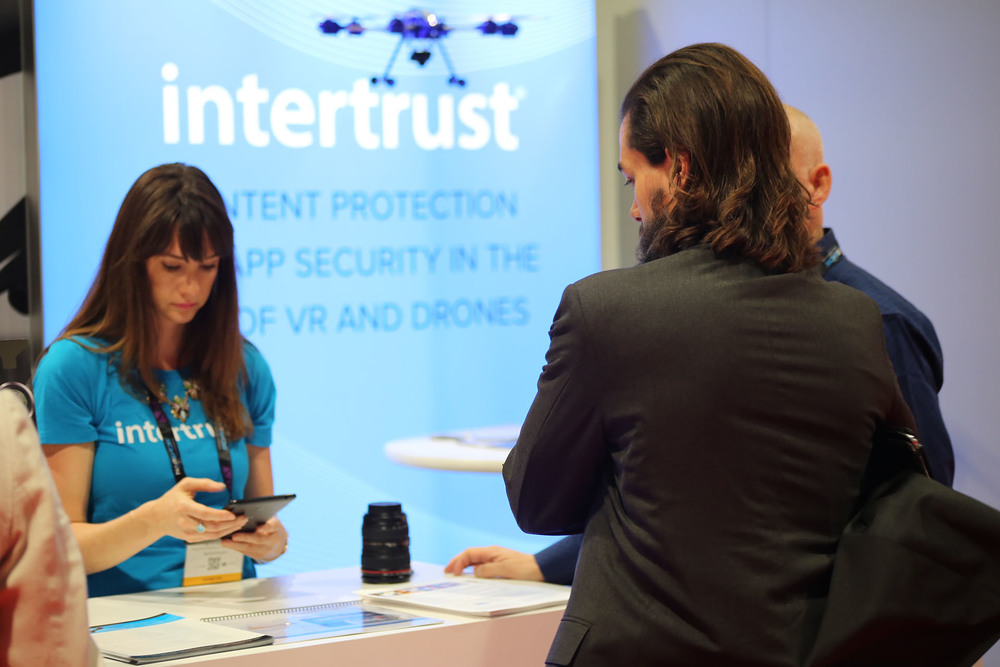 Intertrust Personagraph Product Evangelist Beth Kindig enters an exhibit visitor by scanning his badge.