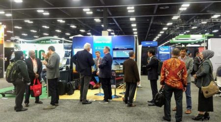 Crowd gathered around the Intertrust Booth at DTECH 2020