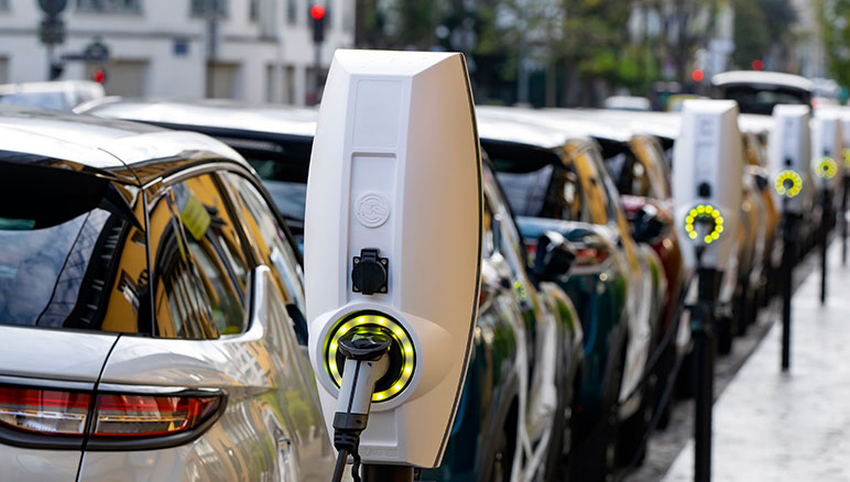 Coordinating EV charging with grid conditions under hero graphic